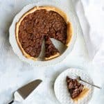 This chocolate bourbon pecan pie is sweetened with honey, molasses, and chocolate chips for a delicious twist on the Southern classic. (No corn syrup!)