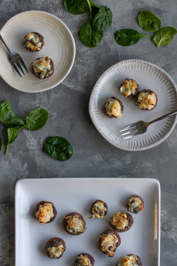 spinach stuffed mushrooms on a serving platter