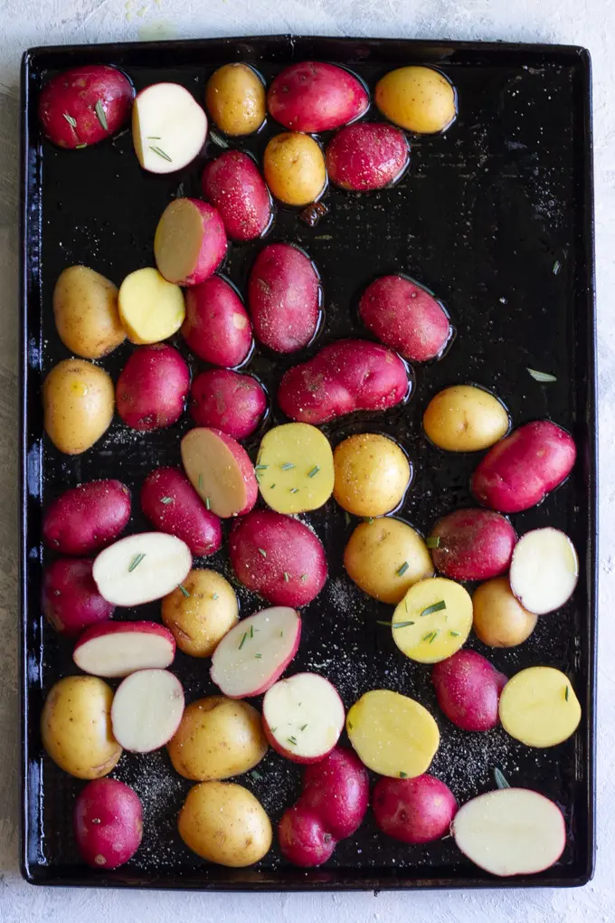 Halve Potatoes, Season, + Arrange on a Baking Sheet