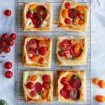 puff pastry tomato tarts on a cooling rack