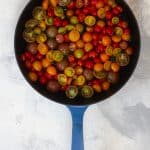 Drizzle halved tomatoes with oil, sprinkle with salt, + arrange on a baking dish
