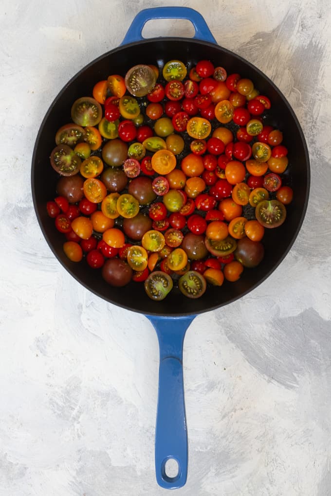 Drizzle halved tomatoes with oil, sprinkle with salt, + arrange on a baking dish