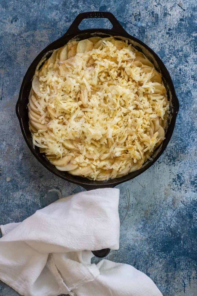 Top potatoes with cheese