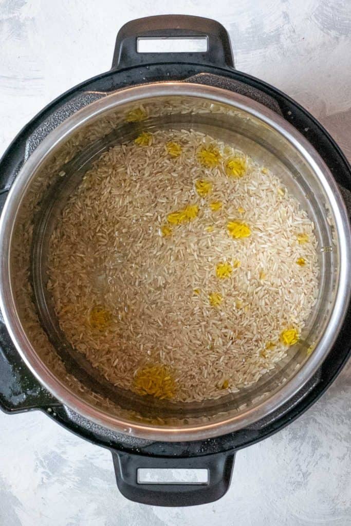 Add brown rice, water, oil + salt the the Instant Pot