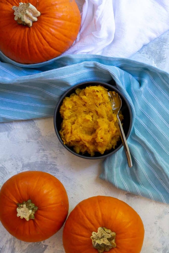 Mash Pumpkin with a Wooden Spoon
