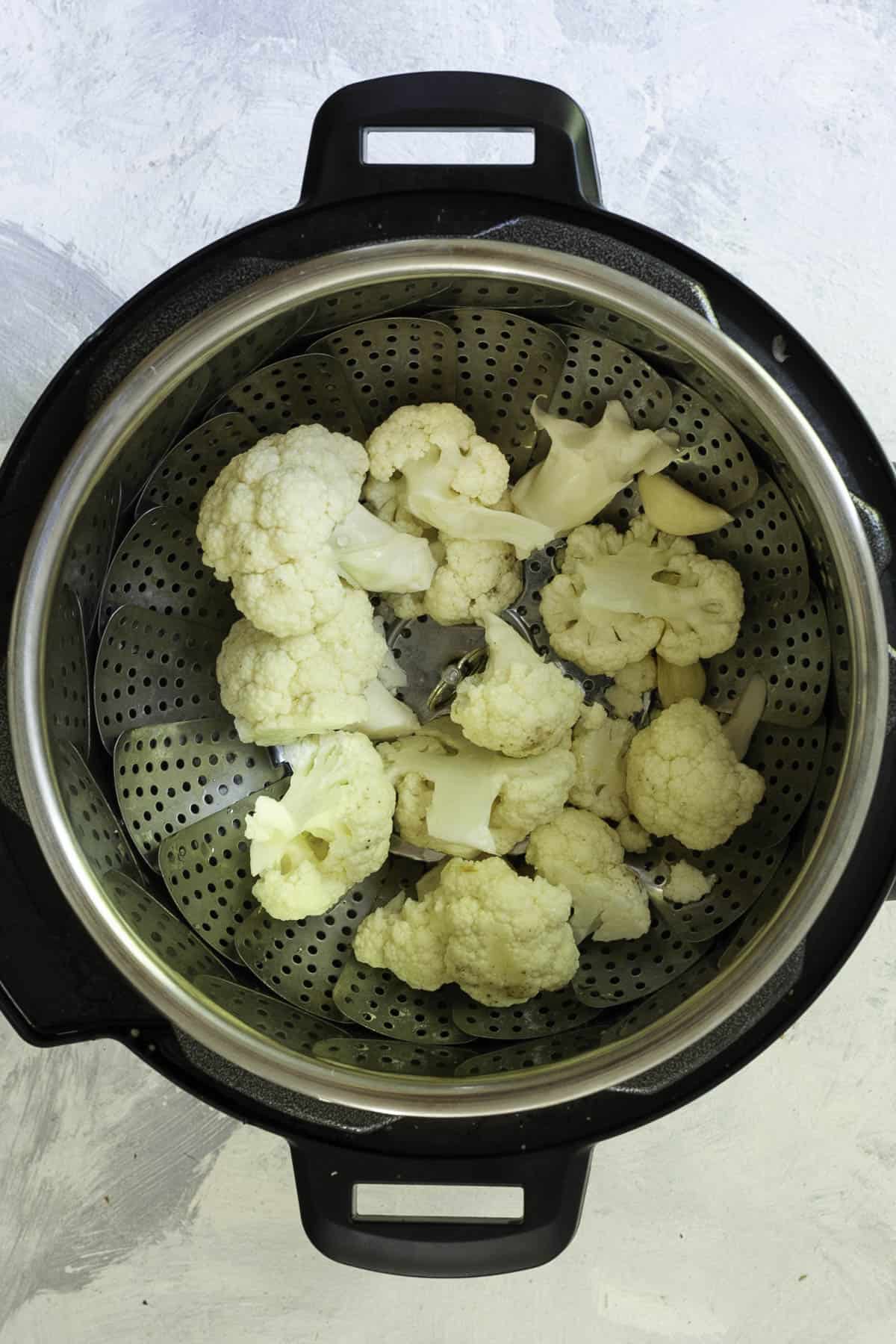 cauliflower in instant pot steamer basket.