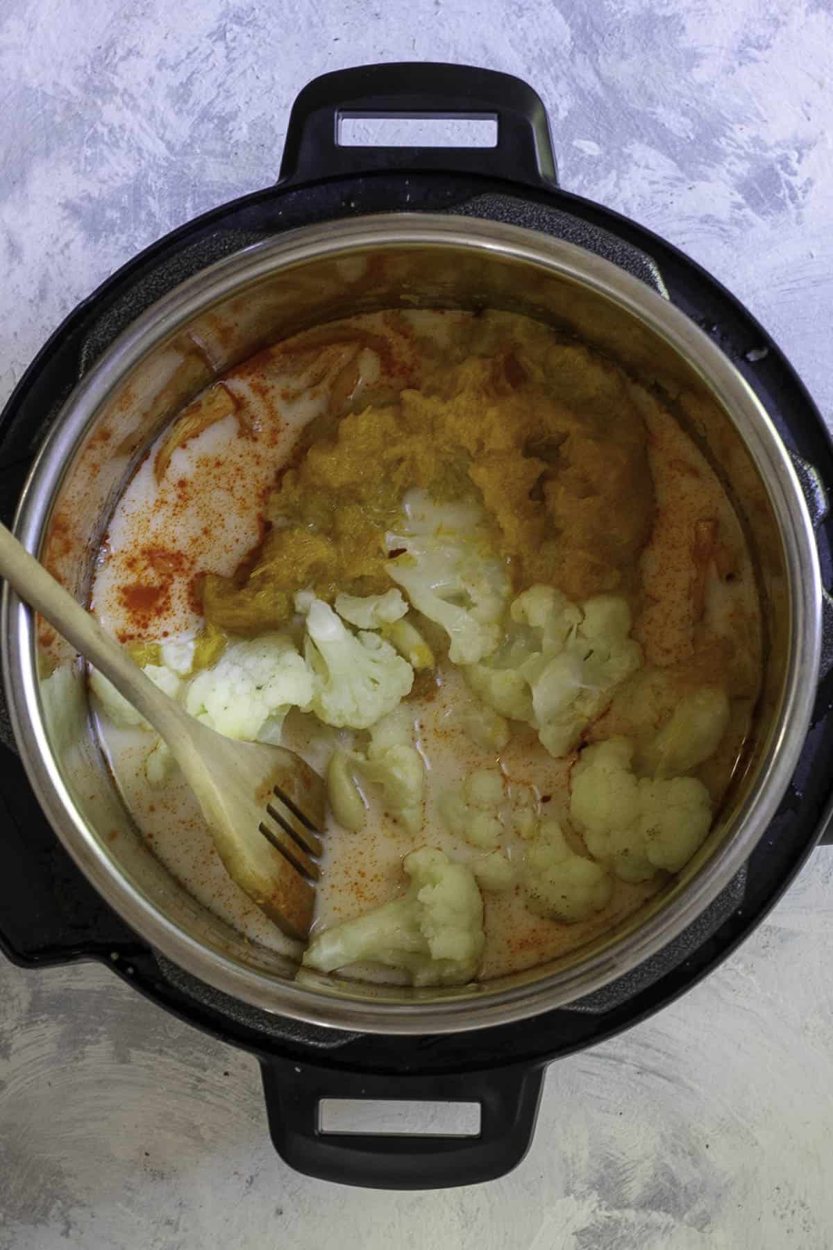 pumpkin, cauliflower, and coconut milk in instant pot.
