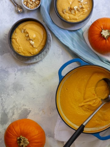 creamy pumpkin soup in serving bowls