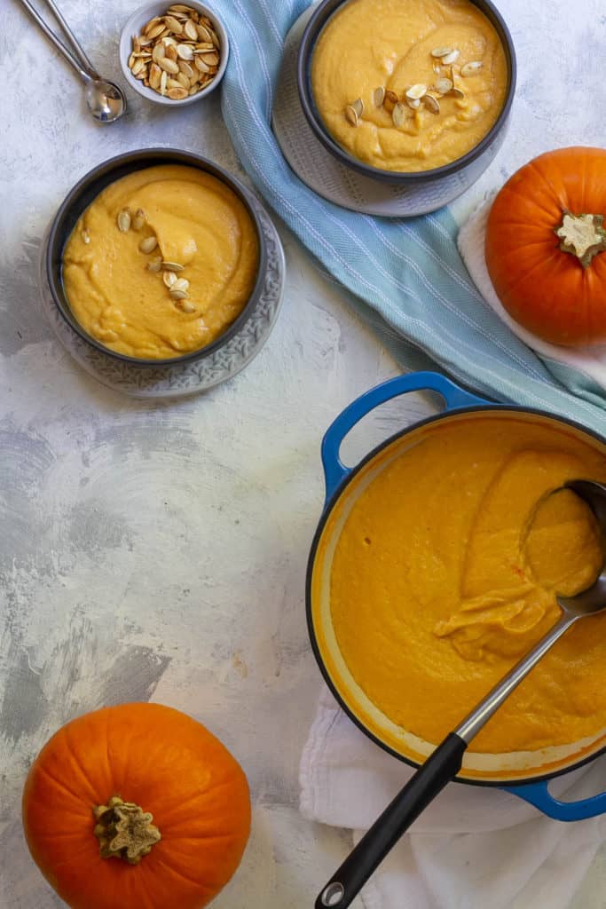 creamy pumpkin soup in serving bowls