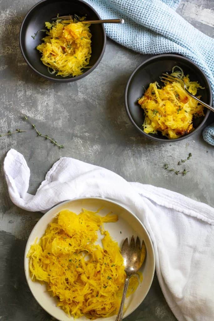 Roasted spaghetti squash in serving dishes