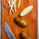 Cut potatoes into long thin strips