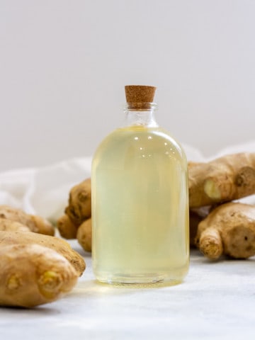 ginger simple syrup in a glass bottle