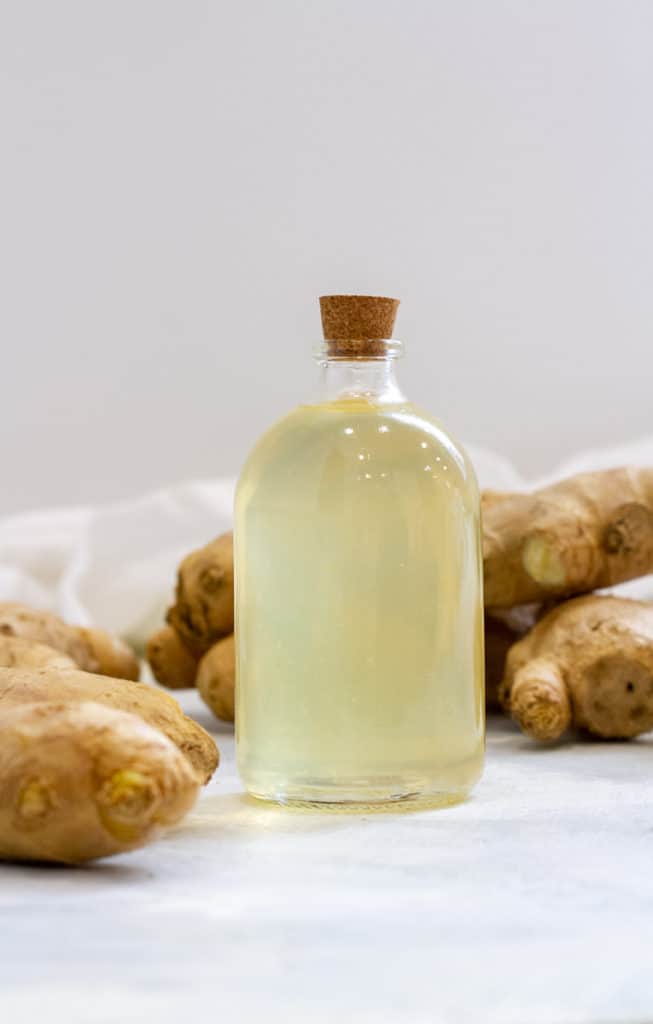 ginger simple syrup in a glass bottle.