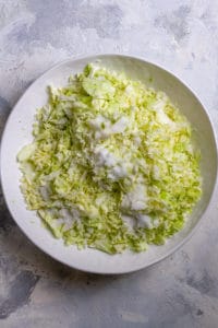 Add Chopped Cabbage + Salt to a Large Bowl