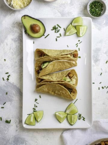 potato tacos on a serving tray.