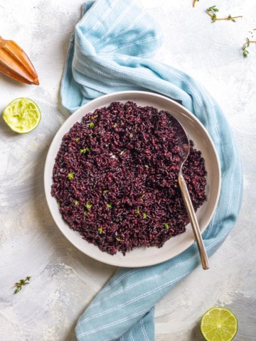 Black rice with lime dressing in a serving dish