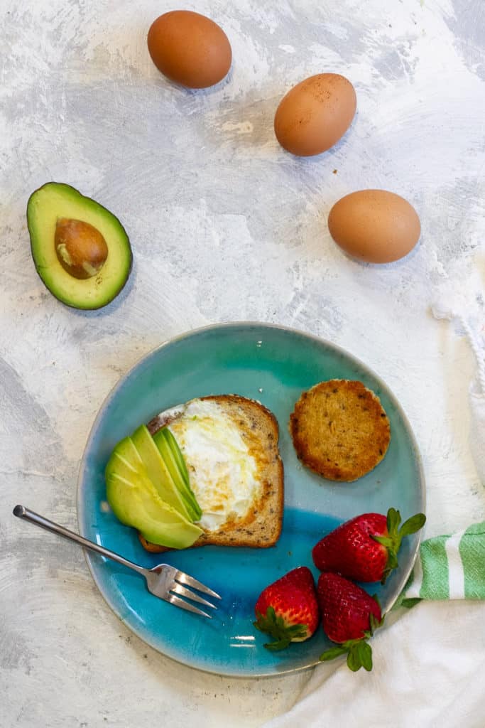 Egg in a whole served with avocado