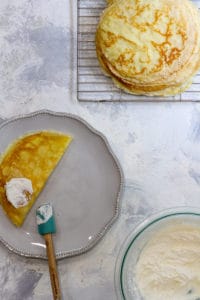 Fold the Crêpe in Half + Top with More Cream