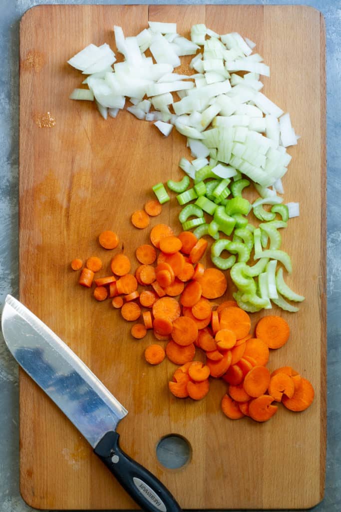 Dice the onion, carrot, + celery