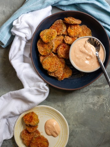 Air fried pickles in a serving dish