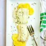 broiled cod on a serving tray