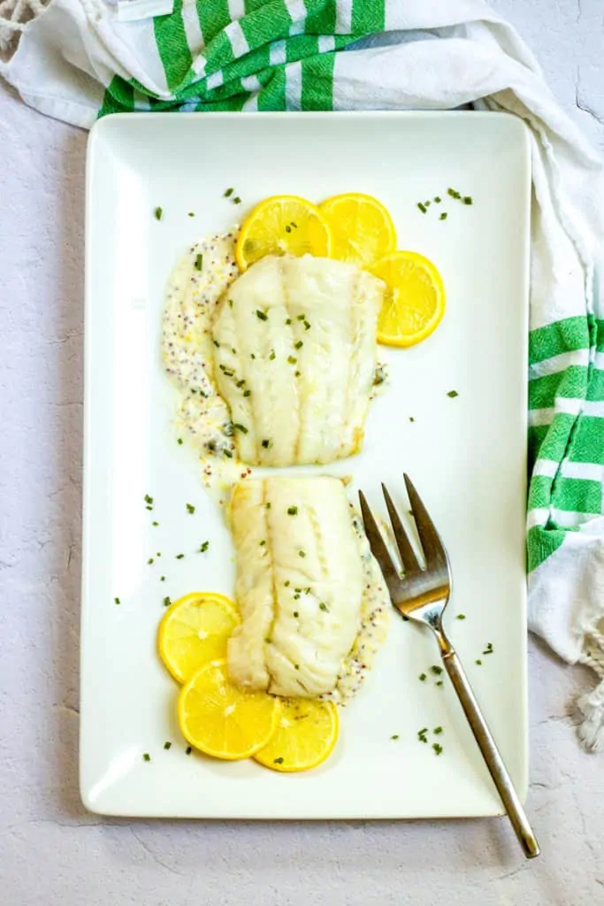 broiled cod on a serving tray.