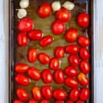 Place Tomatoes + Garlic on a Baking Sheet