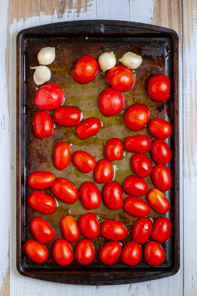 Place Tomatoes + Garlic on a Baking Sheet