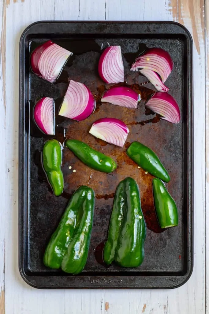Place Peppers + Onions on a Baking Sheet
