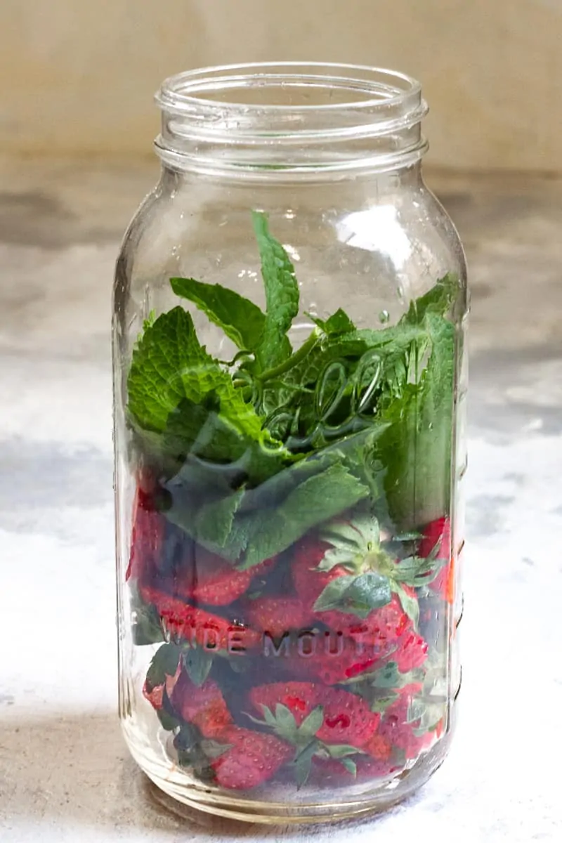 Fill a Jar ¾ Full with Scraps and Herbs.
