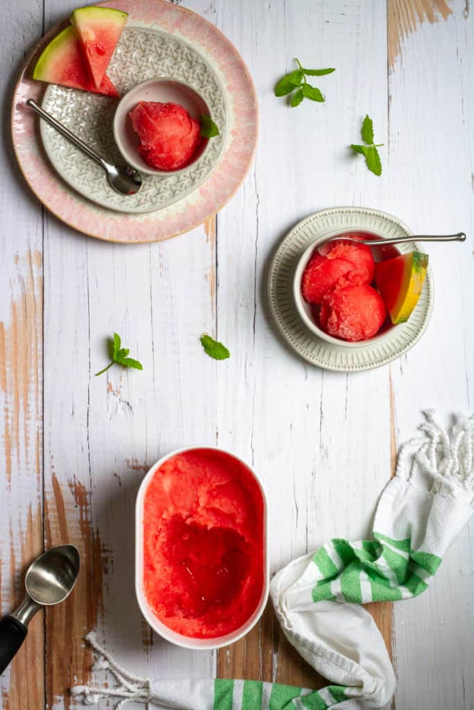 Watermelon Sorbet with Mint in Bowls on a Bessie Bakes Whitewashed Reclaimed Wood Board.