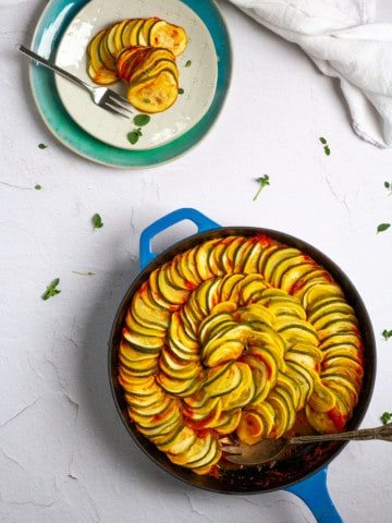 baked zucchini + squash in a serving dish + on a plate