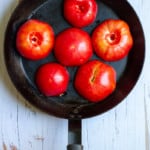 Place Tomatoes Cut-Side Down in an Oven-Safe Pan