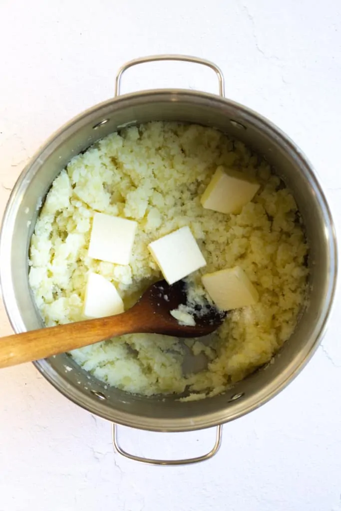 Add Cubes of Butter to Potatoes.