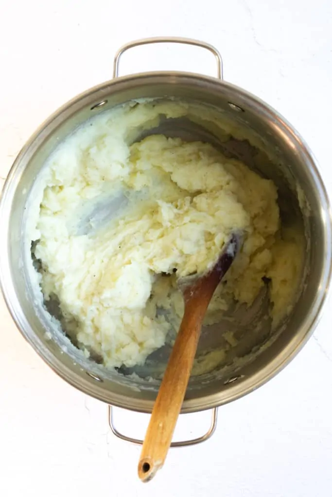 Add Milk or Cream + Beat French mashed potatoes Until Smooth.