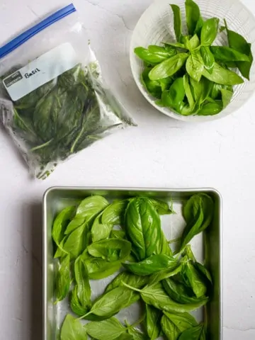 how to freeze basil (basil in freezer tray + bag)