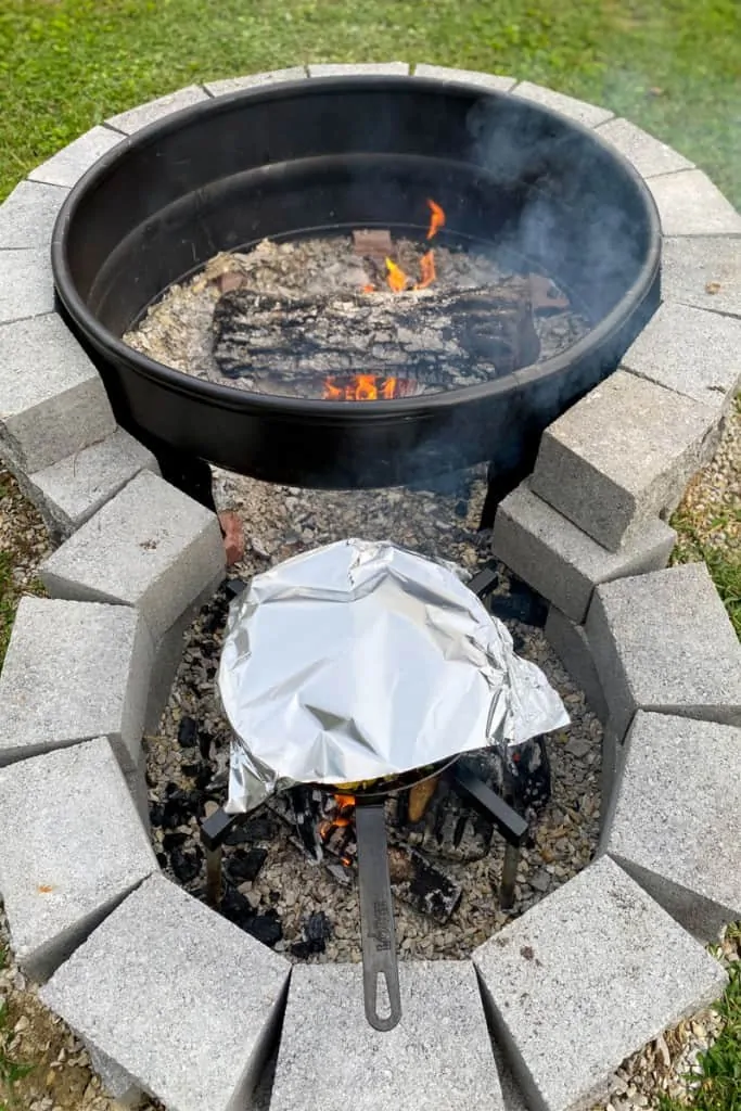 Campfire nachos Cooking in Covered pan Until Cheese Melts.