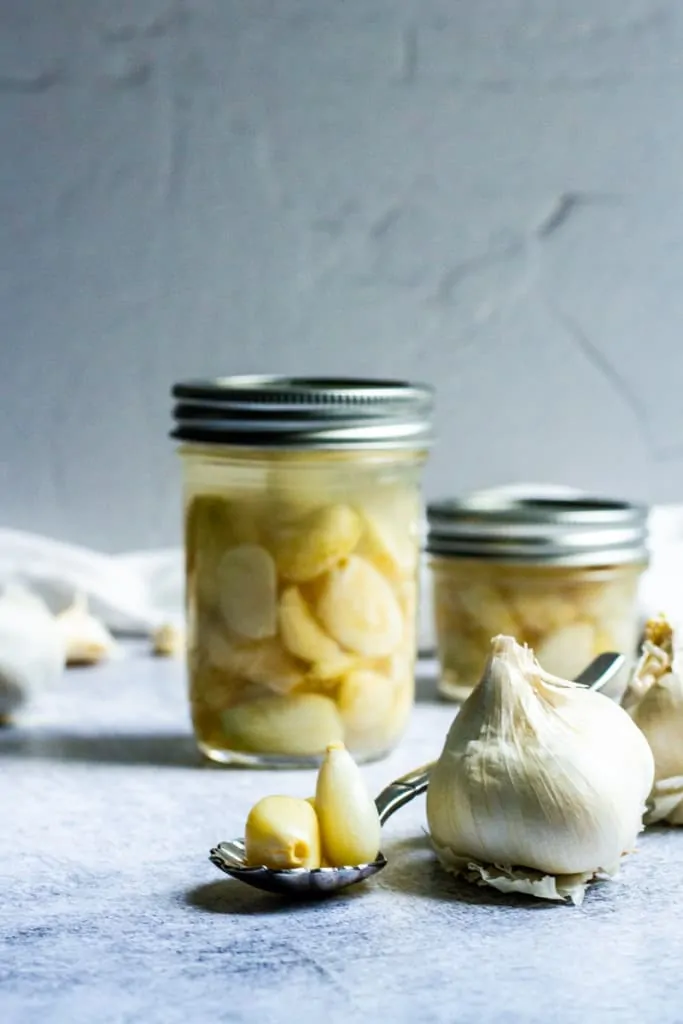 Lacto-fermented garlic in jars.