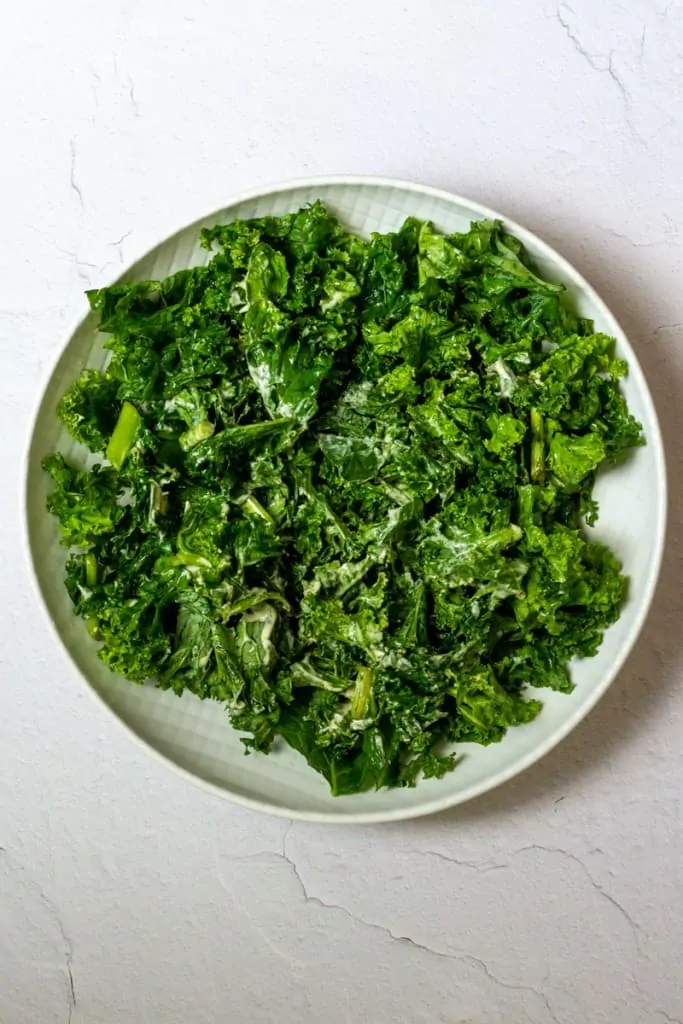 Toss Kale with Half the Dressing