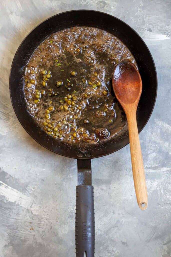 lemon juice, capers and herbs in pan with remaining butter and oil.