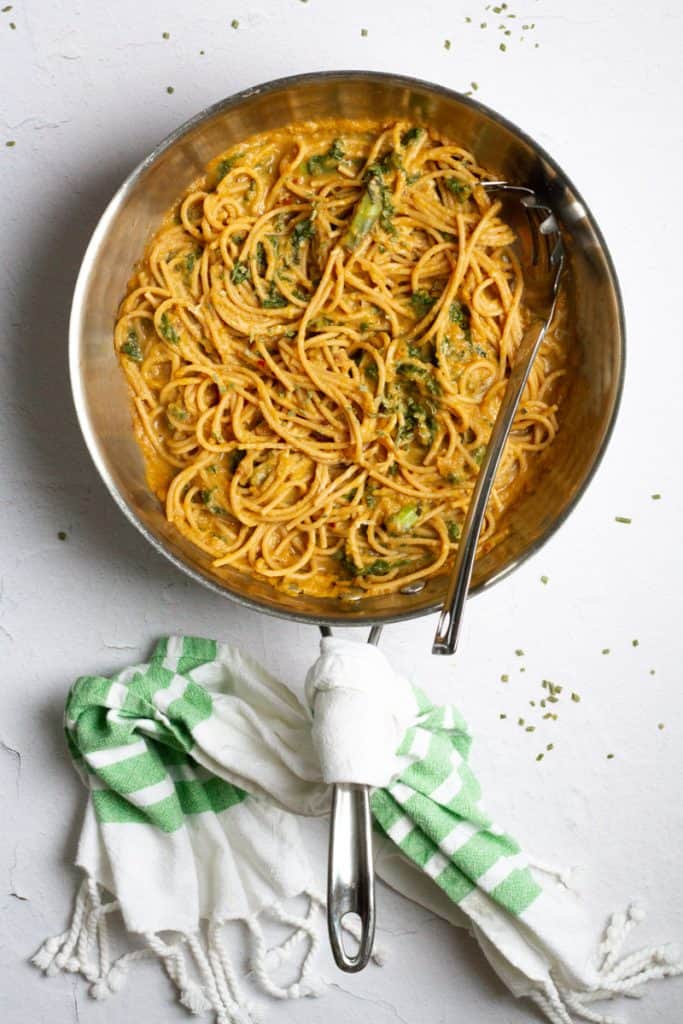 acorn squash pasta with kale in a pan 
