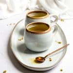 chamomile lavender tea in mugs with honey on a spoon