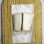 sablefish on a cutting board.