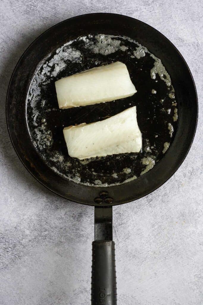 sablefish fillets in a pan.