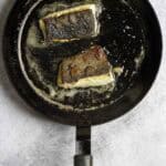 sablefish fillets in a pan.