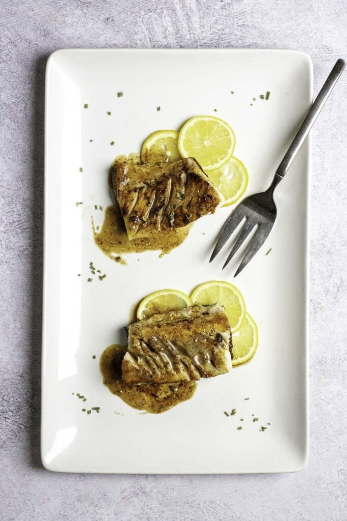 pan-seared sablefish on a platter.