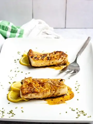 pan-seared black cod (sablefish) with brown butter sauce on a serving platter