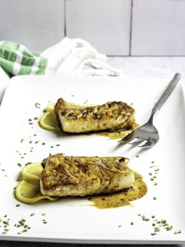 pan-seared sablefish on a platter.