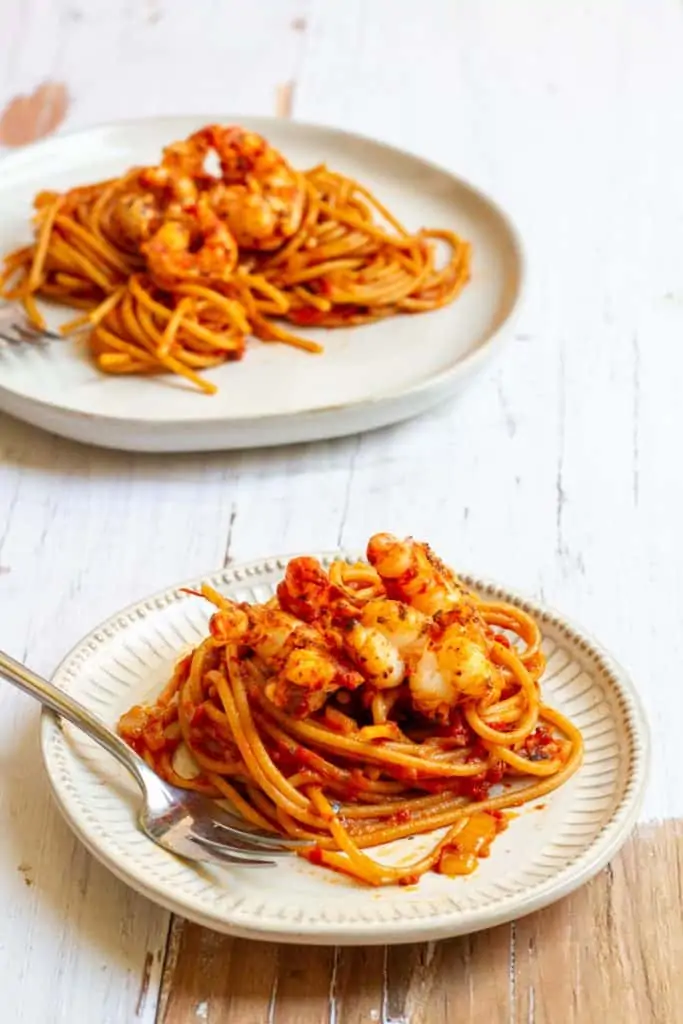 blackened shrimp pasta on plates