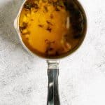 Steep Lemon Zest + Herbs in Warm Oil